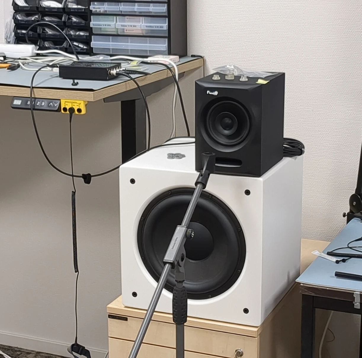 A loudspeaker, a subwoofer and a microphone stand