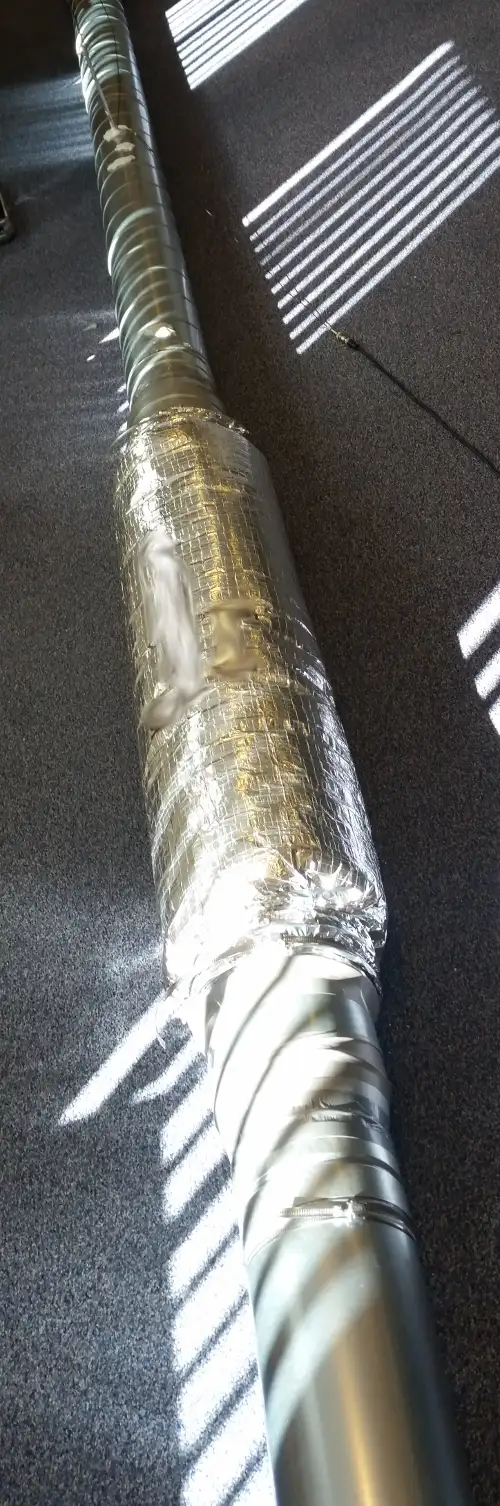 A duct with a passive silencer and a microphone